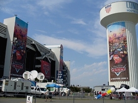 Outside the Lowe's Motor Speedway stadium, people begin to arrive for the CARS premiere.